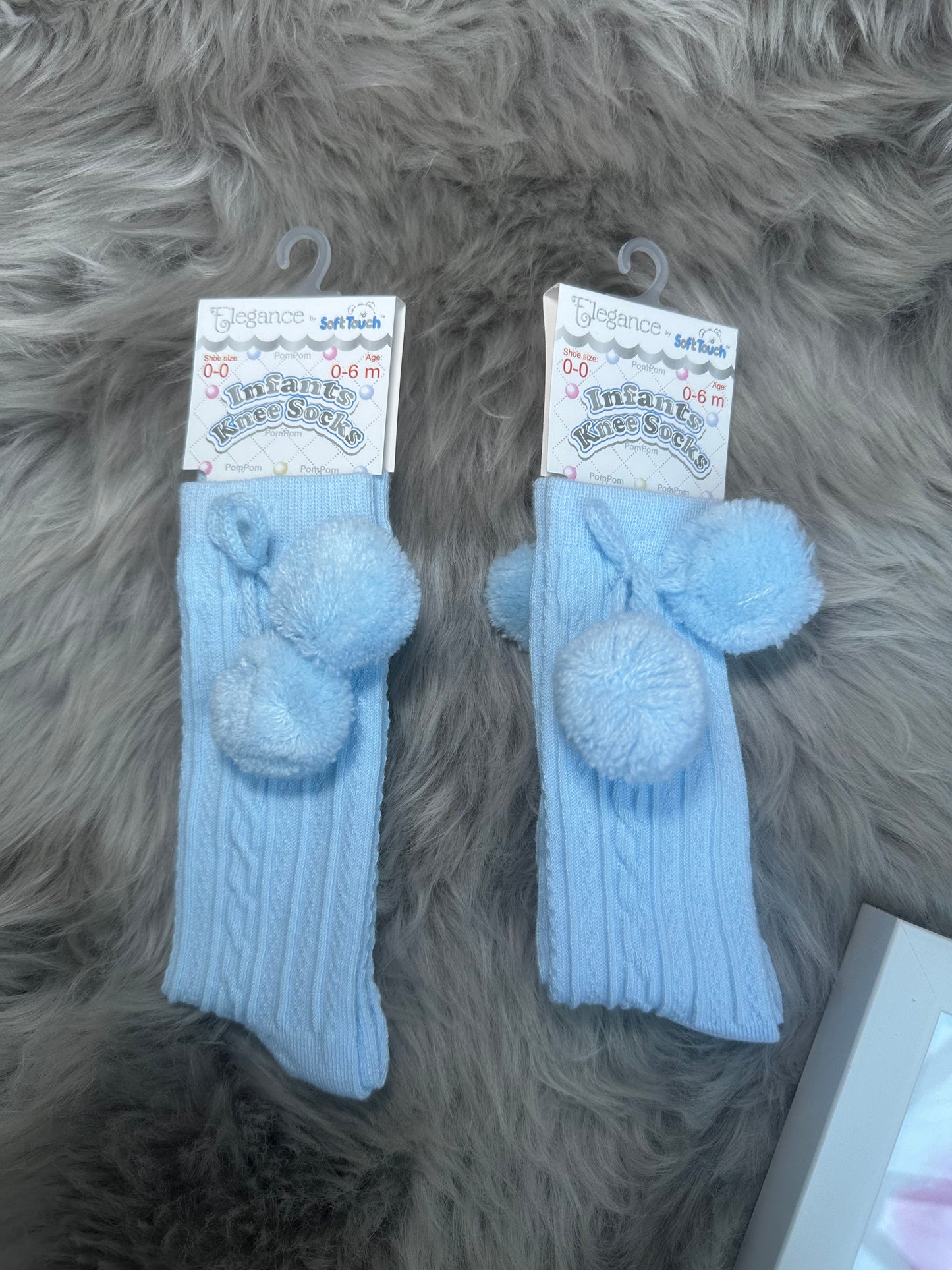 Knee high pom pom socks